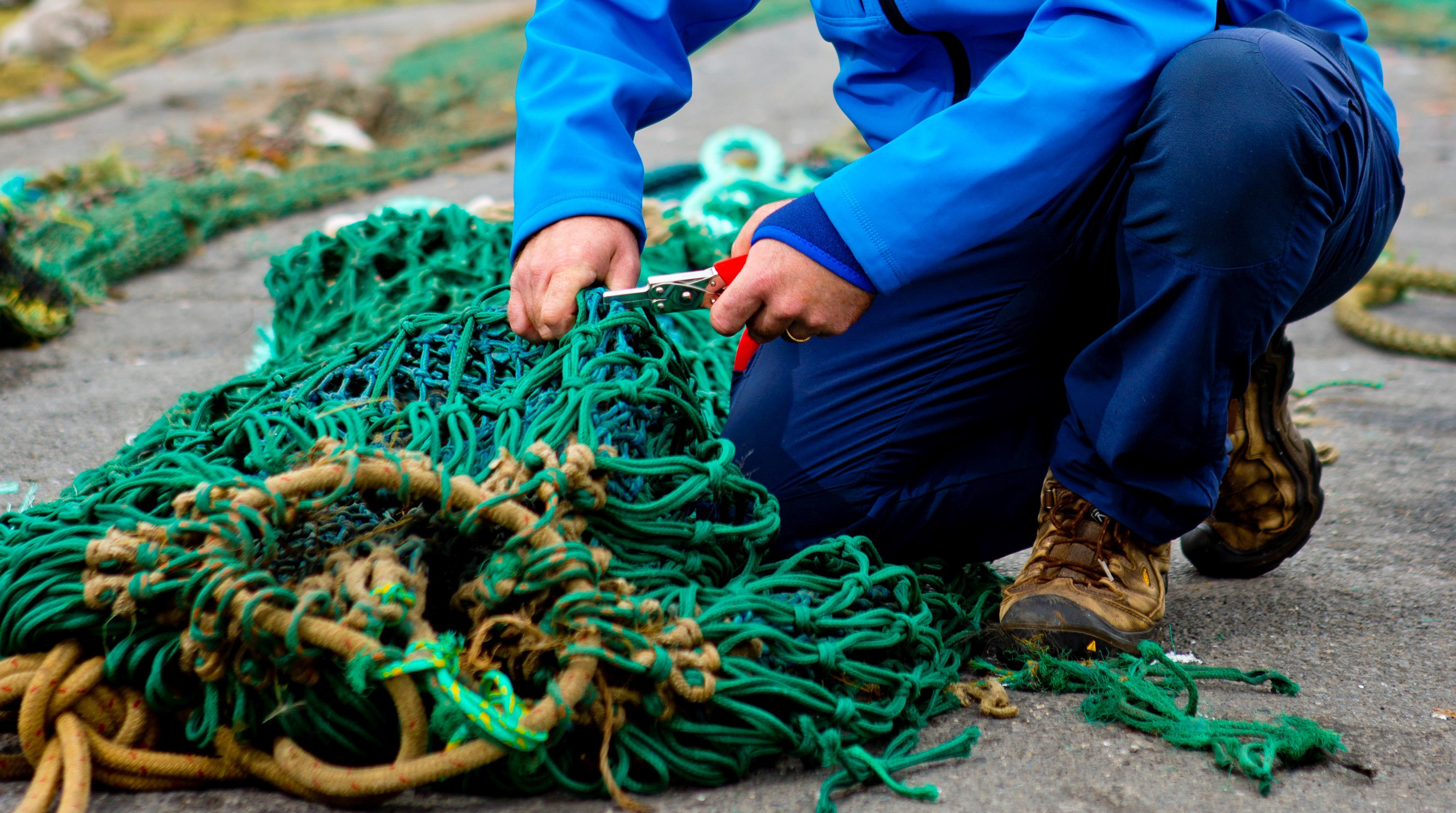 fishing nets being measured by fisheries officer